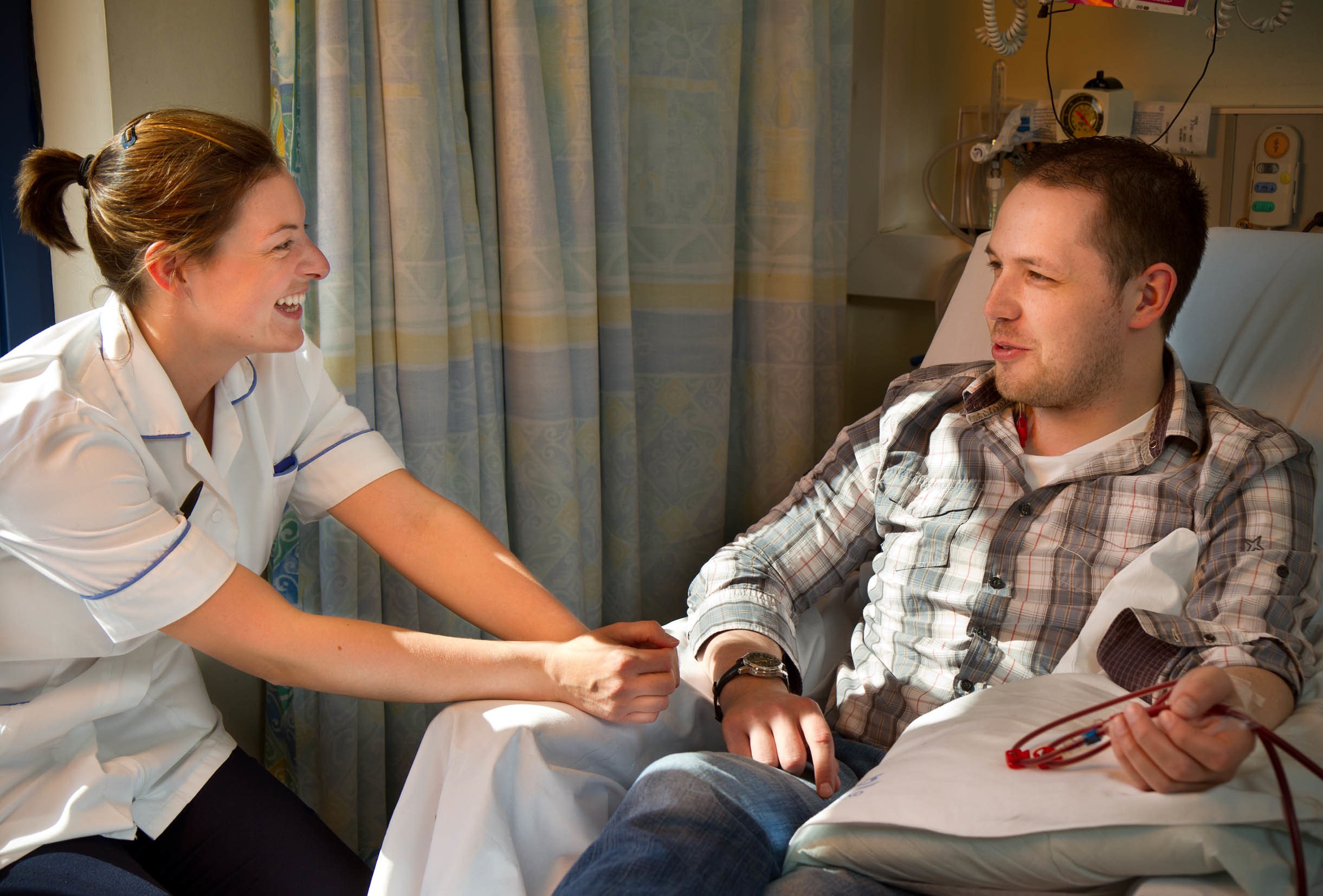 An NHS Scotland member of staff working with a patient.