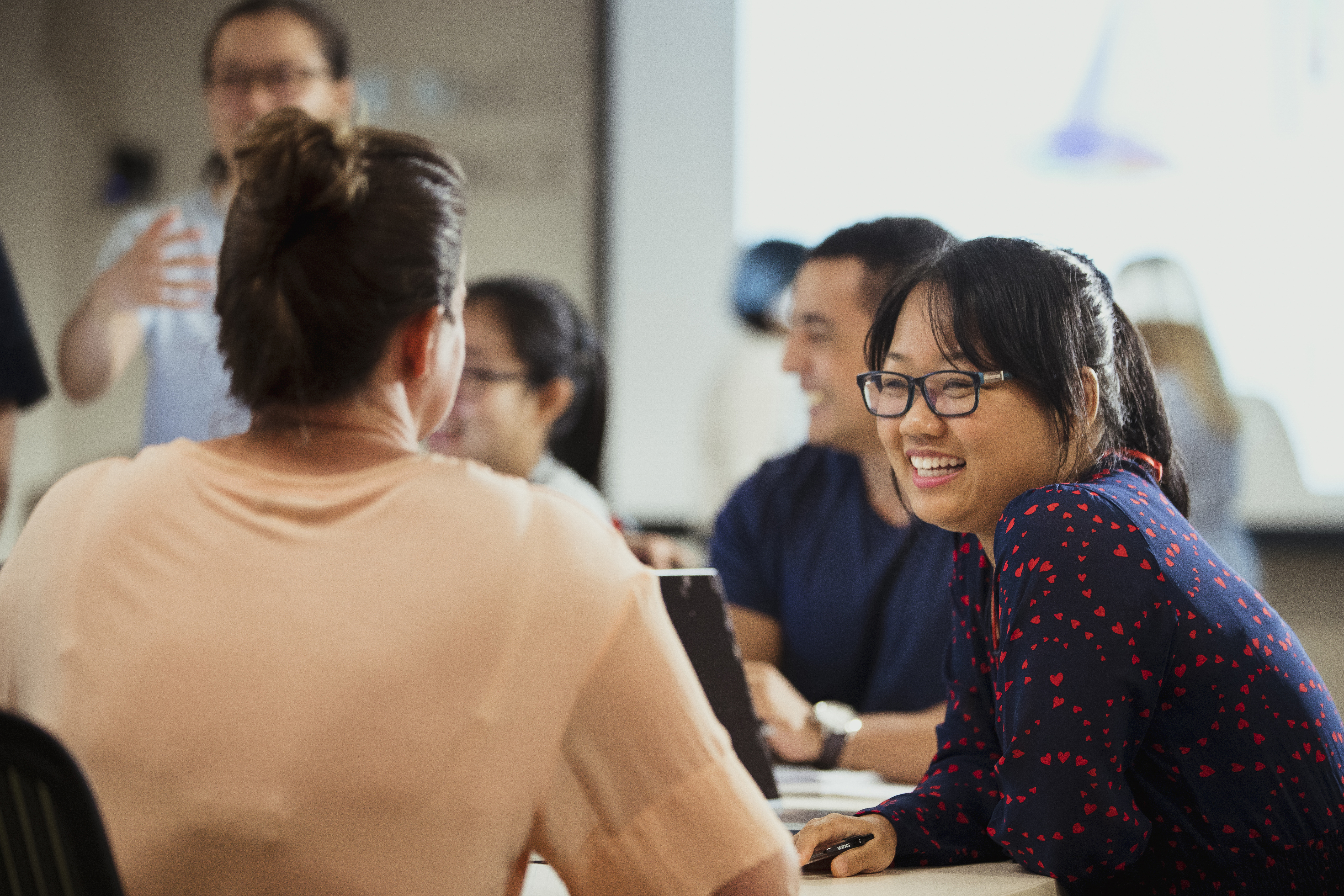 A table of people talking at a networking event.