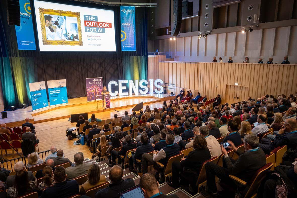 CENSIS Technology Summit a busy plenary room with a speaker on the stage