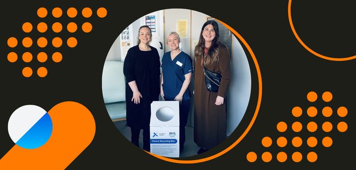 The Cozy Cuddle Scrubs recycling box with staff members Stacey, Marianne and InnoScot Health's Paula Sweeten standing around it,
