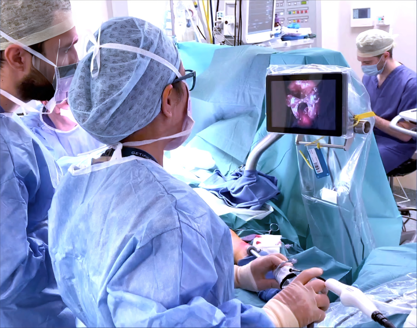 A group of surgeons performing surgery on a patient using innovative technology.