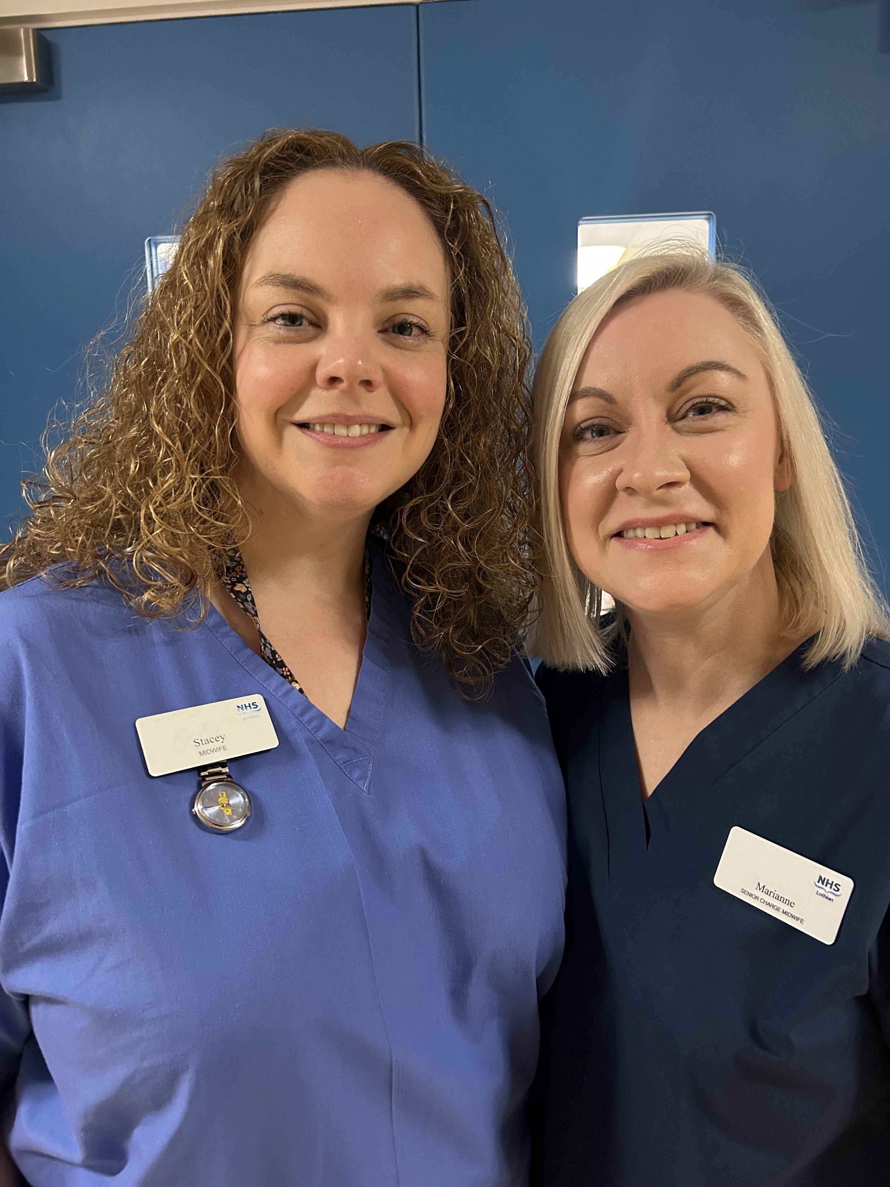 Stacey and Marianne, midwife inventors of the Cozy Cuddle Scrubs, pictured in their NHS Scotland work uniforms.