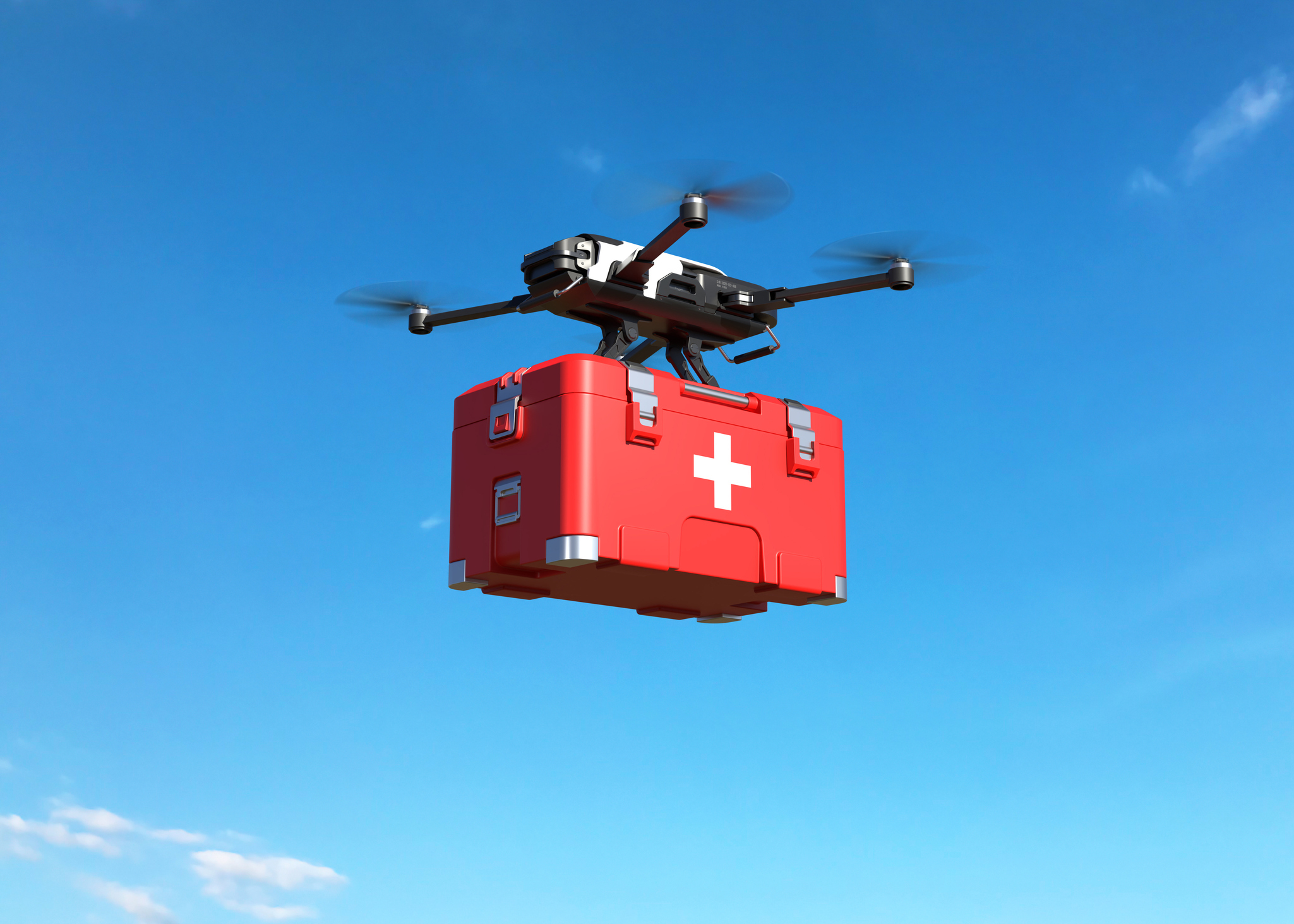 A medical drone flying against a clear blue sky.