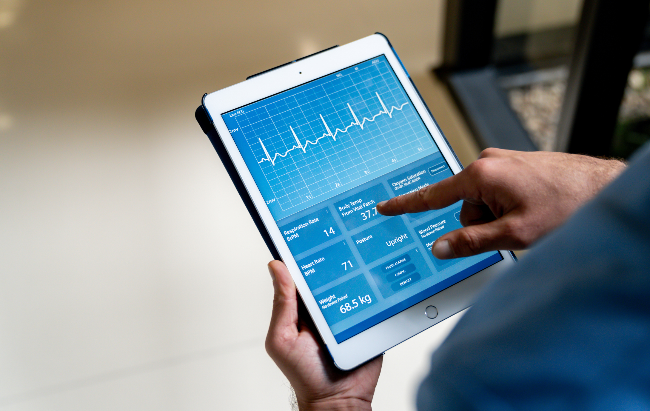 A person looking at an ECG readout on a tablet.